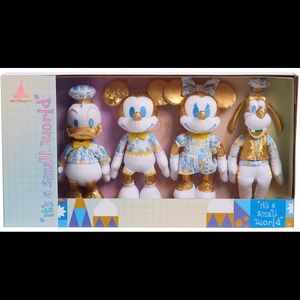 Disney Walt world 50th anniversary celebration it's a small world plush set
